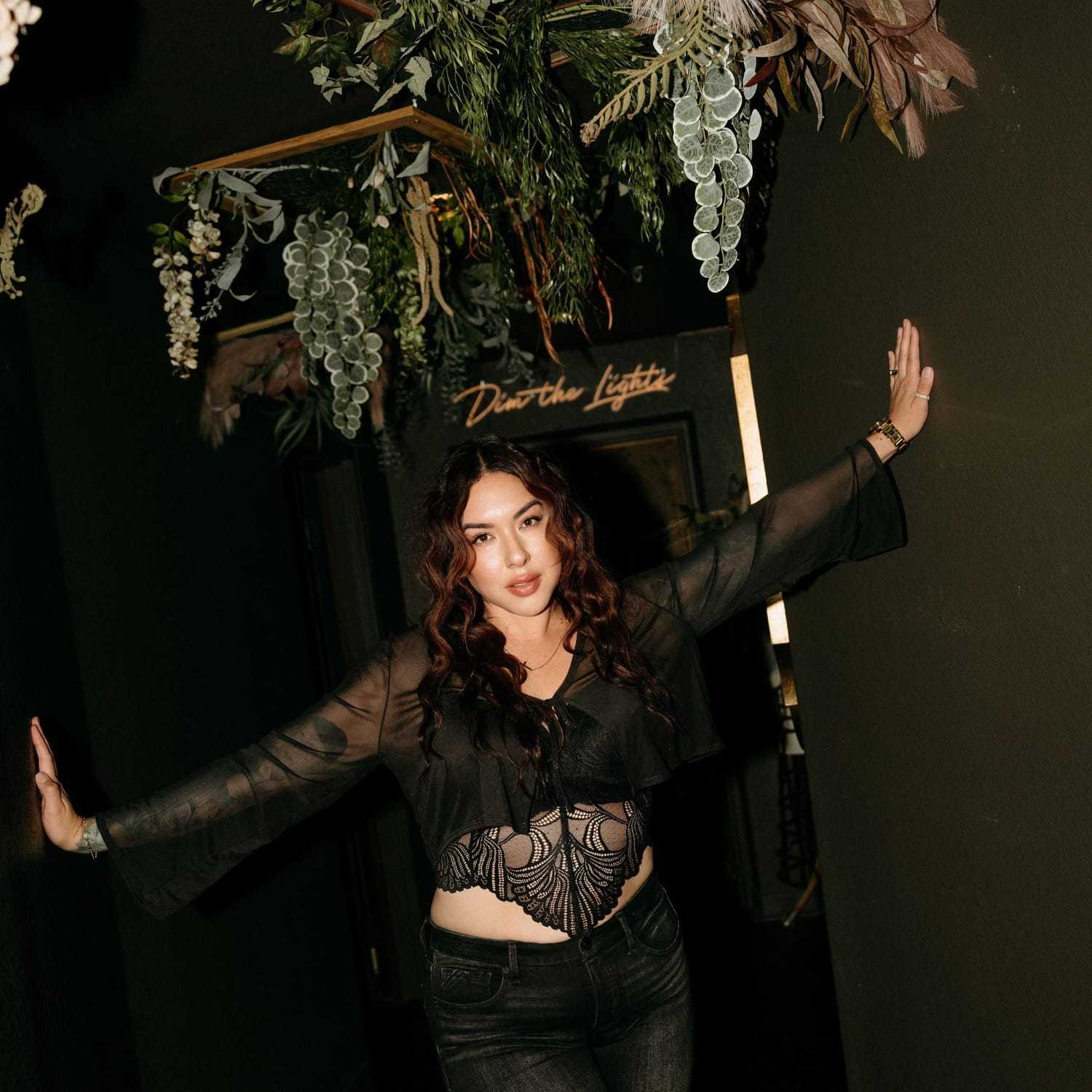 Portrait of Jenna Rojas, a professional stylist at Extension 809, showcasing their expertise and style.