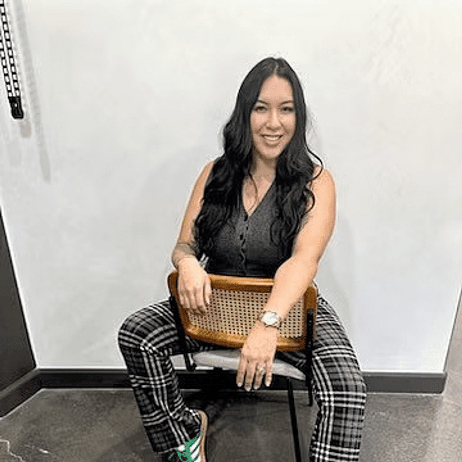 Portrait of Jenna Rojas, a professional stylist at Extension 809, showcasing their expertise and style.