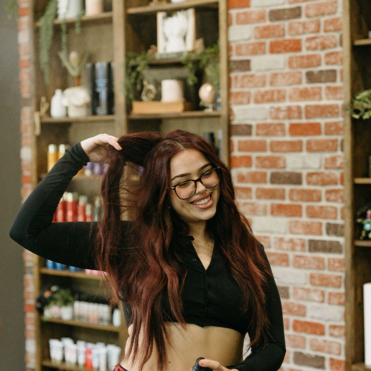 Portrait of Montana Marroquin, a professional stylist at Extension 809, showcasing their expertise and style.