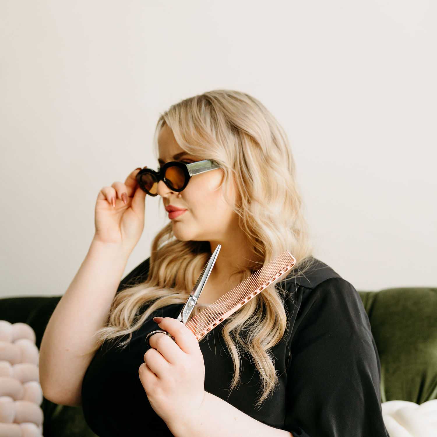 Portrait of Ashley Jordan, a professional stylist at Extension 809, showcasing their expertise and style.