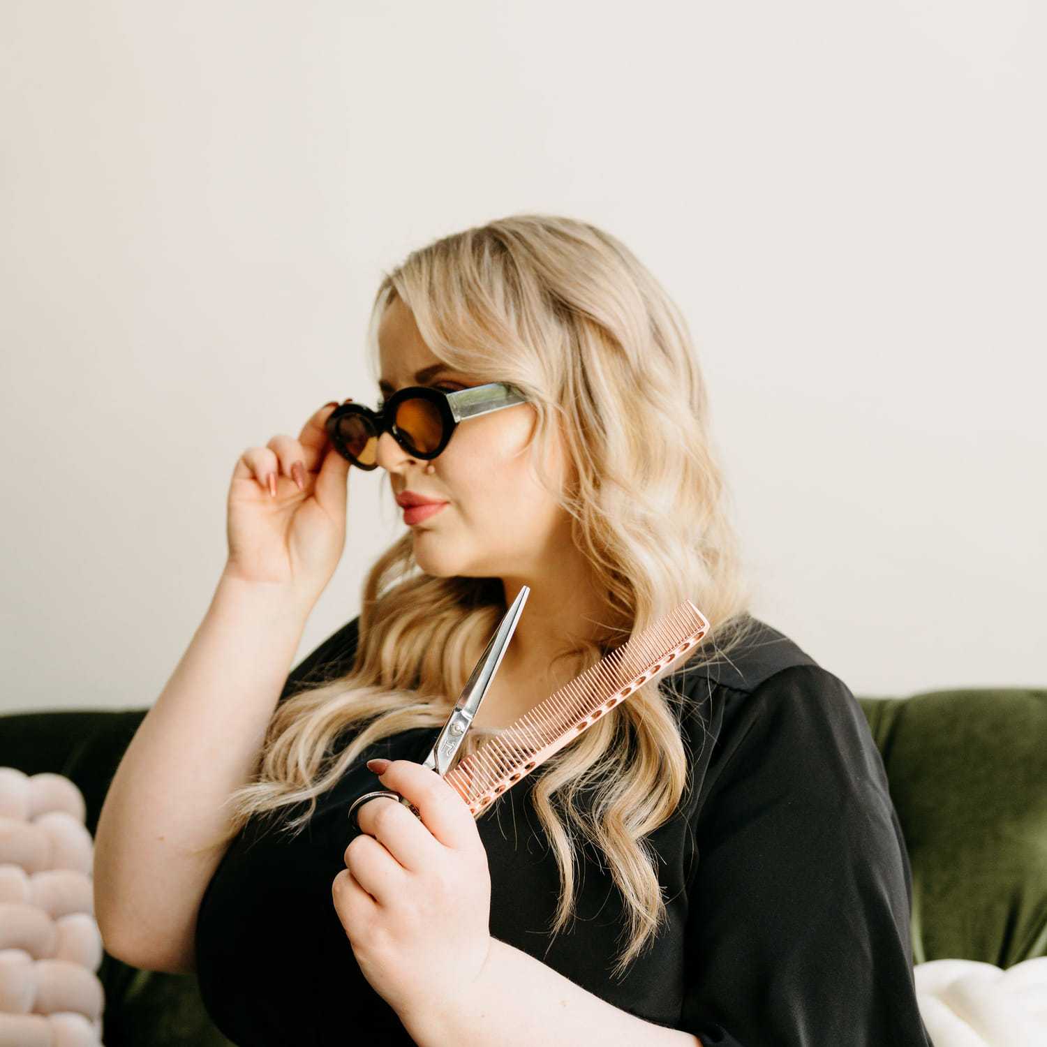 Portrait of Ashley Jordan, a professional stylist at Extension 809, showcasing their expertise and style.