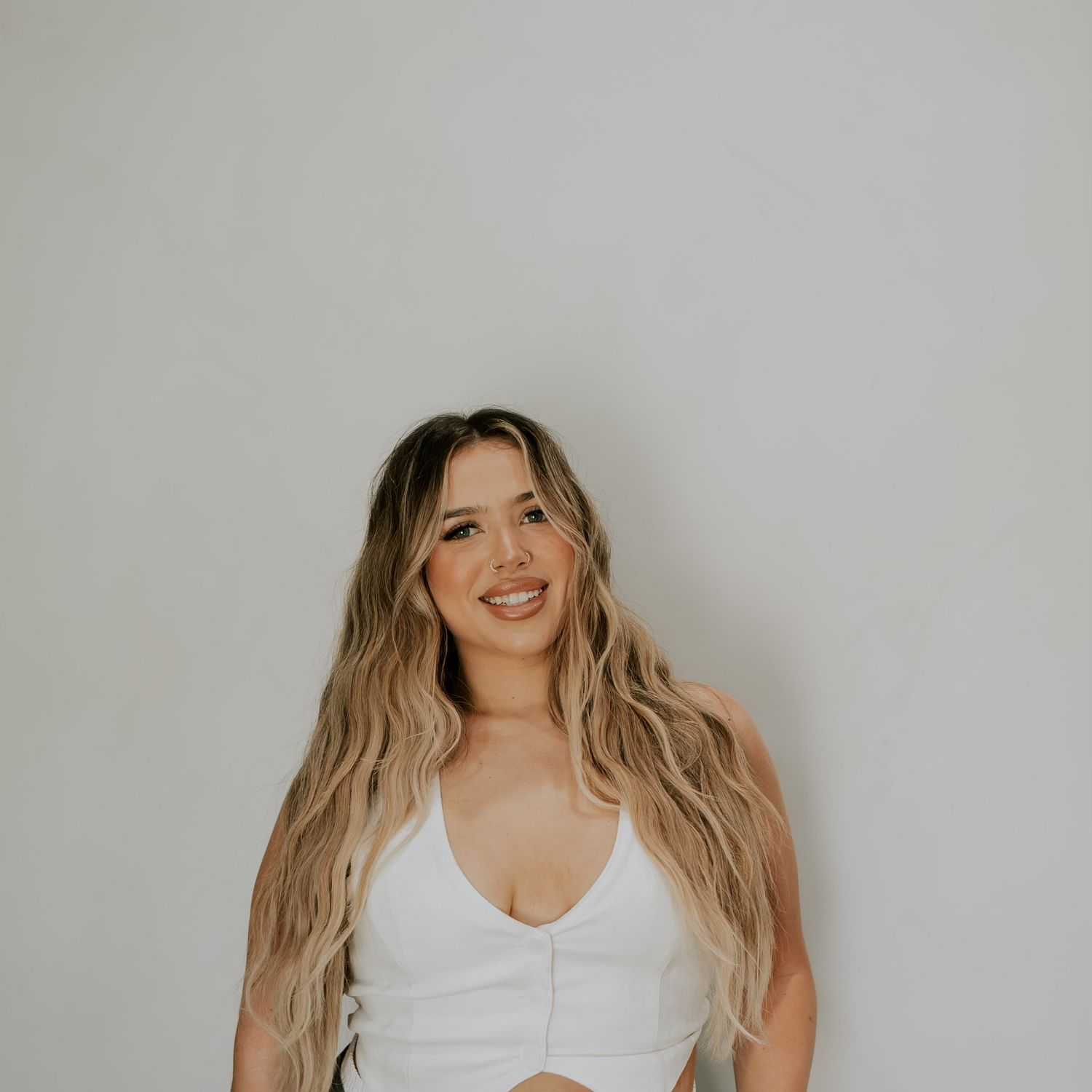 Portrait of Montana Marroquin, a professional stylist at Extension 809, showcasing their expertise and style.